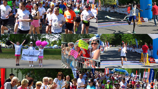 Zawodnicy biegną ulicami Krapkowic podczas Krapkowickiego Biegu Ulicznego z kibicami dopingującymi na trasie.