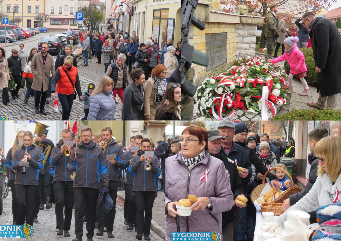 Na zdjęciu Mieszkańcy Krapkowic uczestniczą w obchodach Święta Niepodległości 2025, składając kwiaty pod pomnikiem Ofiar Wojen i Przemocy i odśpiewując hymn narodowy.